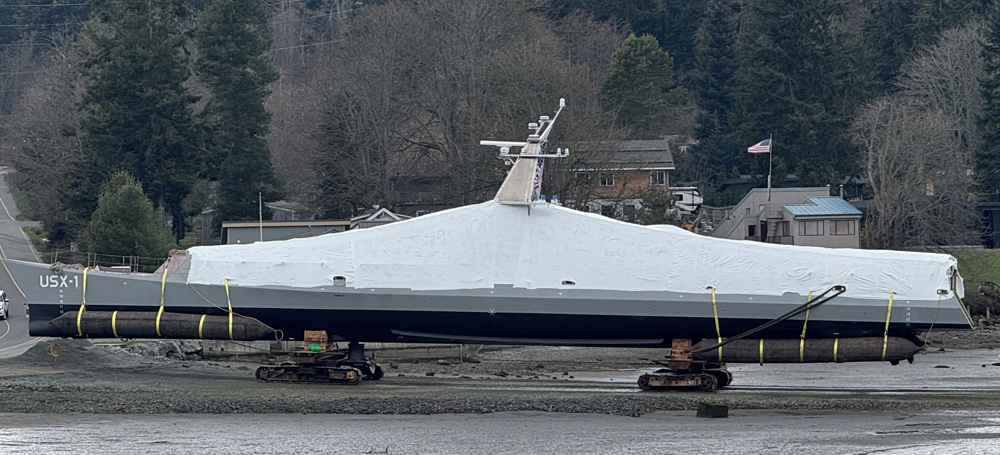 NOMARS USX-1 Defiant is transported from the shipyard to the water to begin testing.