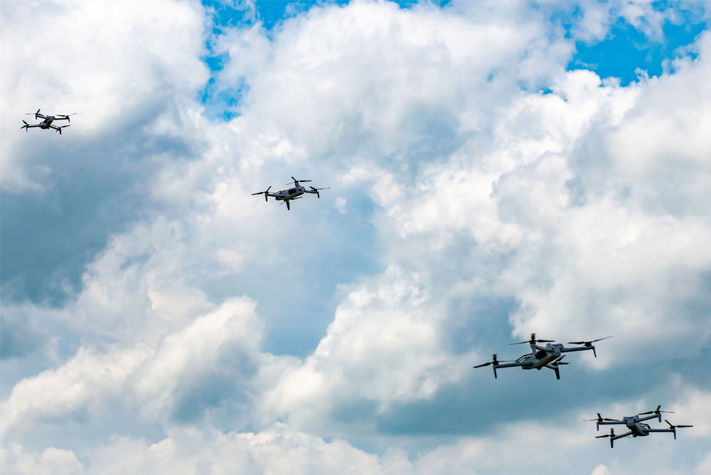 Four uncrewed aerial vehicles (UAV) takes flight during the DARPA Triage Challenge Workshop 1 event.