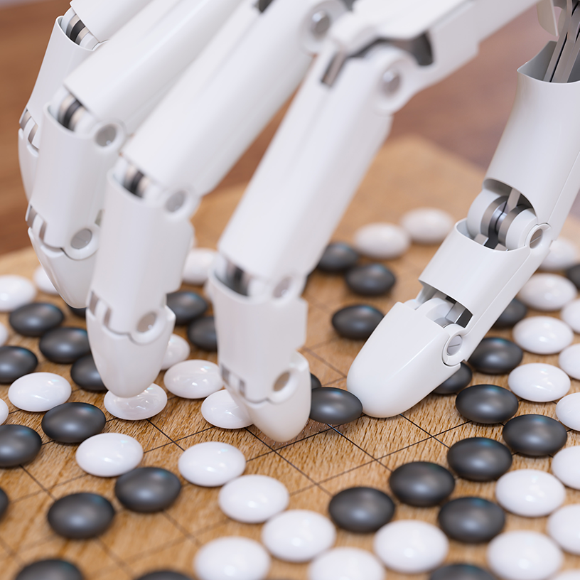 Robotic hand playing a board game