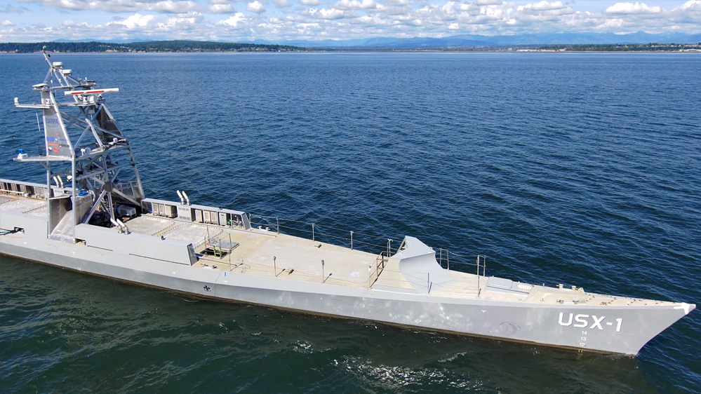 The NOMARS program demonstrator vessel, USX-1 Defiant, conducts in-water testing in the Puget Sound. 