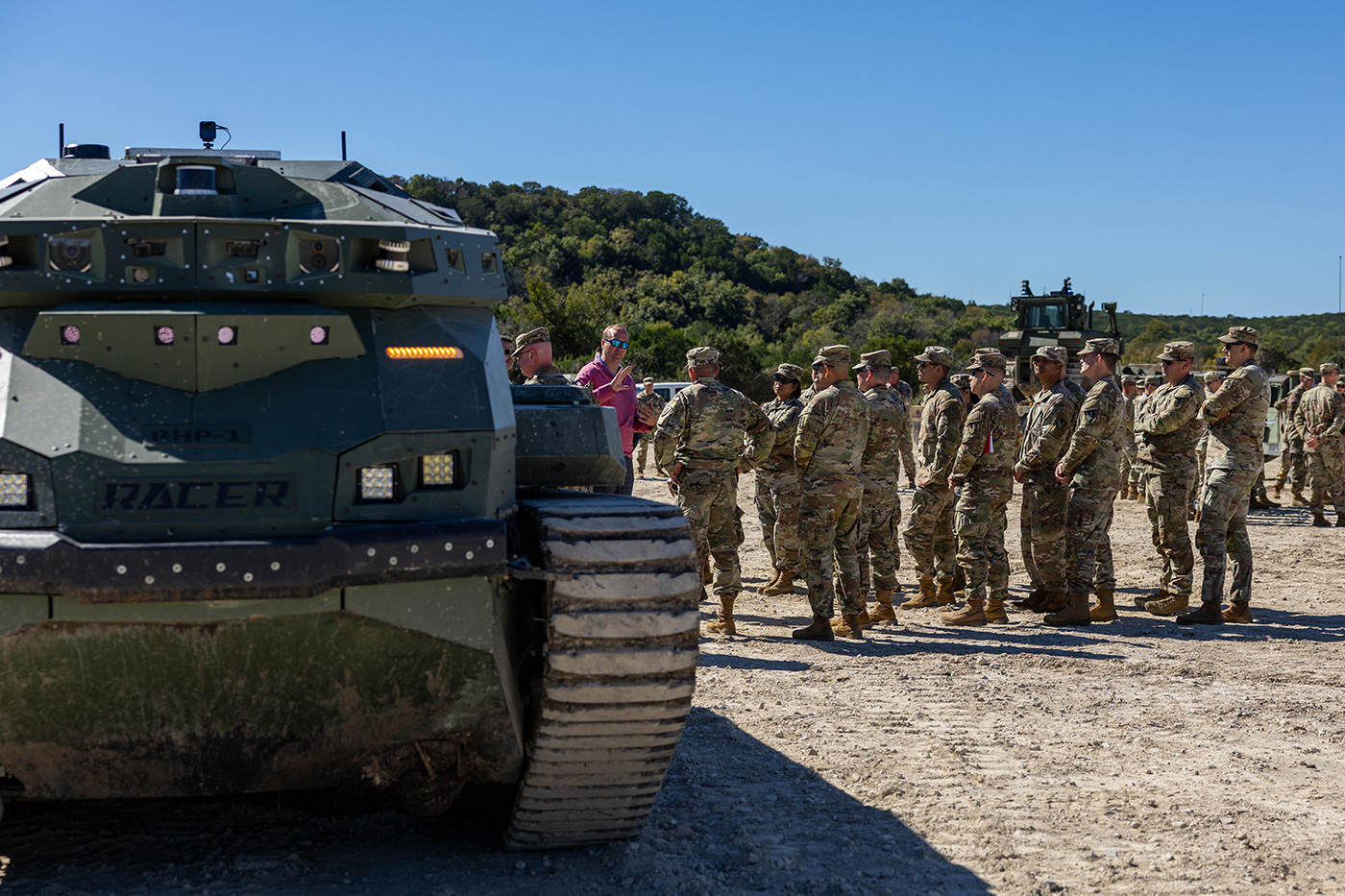 The U.S. Army’s III Armored Corps' 36th Engineer Brigade standing next to the RACER Heavy Platform at their combat breaching October 2025 demonstration.