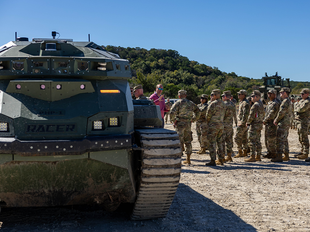The U.S. Army’s III Armored Corps' 36th Engineer Brigade standing next to the RACER Heavy Platform at their combat breaching October 2025 demonstration.