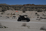 An unmanned RACER Fleet Vehicle executes complex terrain during RACER Experiment 3.